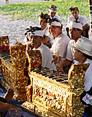 Locals at a Balinese Festival on the beach, Seminyak Beach, Bali, Indonesia