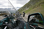 Motorbike tour in June over alpine passes, parking site summit pass at Timmelsjoch between Austria and Italy