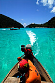 Boat in clear blue water close to Surin Islands Marine National Park, headquarter, Ko Surin, Phang Nga, Thailand