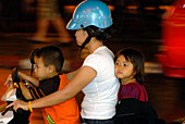 Mother with two children on a motorbike, Patong, Phuket, Thailand