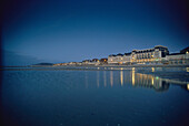 Beach with Grand Hotel in the evening light, Cabourg, Normandy, France