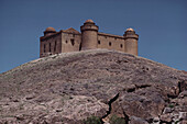 Renaissance castle of Lacalahorra on a smooth rocktop, Sierra Nevada, Granada province, Andalusia. Spain