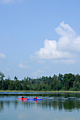 two kayakers on lake Fohnsee, Osterseen, Upper Bavaria, Bavaria, Germany