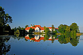 Seeon Abbey in Lake Seeon, Chiemgau, Upper Bavaria, Bavaria, Germany