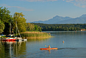 lake Waginger See with kayaker and sailing boats, Tettenhausen, Chiemgau, Upper Bavaria, Bavaria, Germany