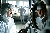 Man working on a High Vaccum Equipment, Clean Room, Nanosystems, Faculty for Physics, LMU, Ludwig Maximilians Universität, Munich, Bavaria, Germany