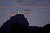 Illuminated Christ the Redeemer statue on Corcovado mountain at night, Rio de Janeiro, Rio de Janeiro, Brazil
