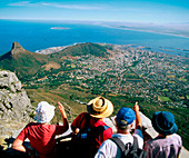 Tourists looking at Cape Town from Table Mountain. South Africa