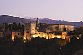 The Alhambra Palace and Sierra Nevada mountains in background, Granada. Andalusia, Spain