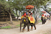 Elephant ride among the ruins of ancient Ayutthaya. Ayutthaya City. Thailand. January 2007.