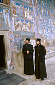 Orthodox monks. Voronet monastery. Bucovina. Romania.