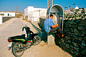 Man on the phone in Mikonos. Greece