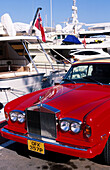 Rolls Royce and luxurious yacht in Puerto Banus. Marbella. Malaga province. Costa del Sol. Andalucia. Spain