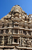 Ornate sculptures in three tiers around Paraswanath Temple, Khajuraho. Madhya Pradesh, India