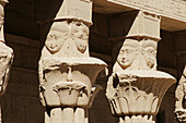 Philae temple, built for Isis. Faces on top of columns. Aswan. Egypt