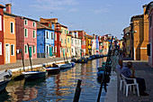 Laguna (lagoon) di Venezia. Burano. A canal with the typical colourful houses. Venice. Italy