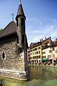 The Palais (palace) de l Ile, the Thiou river and the riverside. Annecy. France.