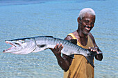Fisherman and his barracuda. Dominican Republic