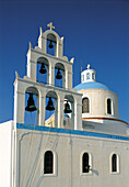 Colored Belfry & church dome. Santorini island. Cyclades. Greece