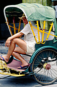 Man waiting in a rickshaw. Hong Kong. China