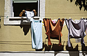 Clothes drying at window. Lisbon. Portugal