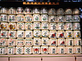 Sake bottles (offerings) at entrance to shrine. Tokyo. Japan