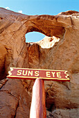Window in red rock called Sun s eye . Monument Valley. Utah. USA