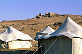 Soldiers tents near ruined Roman fortress at Kharga oasis. Libyan desert, Egypt