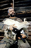 Goat cheese maker with goats. Corsica Island. France