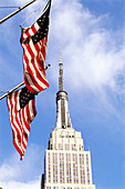 American flags and Empire State building, New York City. USA