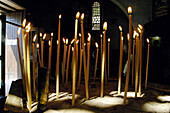 Burning candles in the Saint Neophytos monastery church. Cyprus