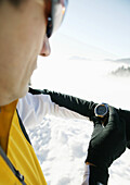 Man checking his heart rate monitor, Styria, Austria