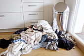  At home, Clothes, Color, Colour, Concept, Concepts, Contemporary, Corner, Corners, Daytime, Dirty clothes, Disorder, Garment, Heap, Heaps, Home, Horizontal, Housework, Indoor, Indoors, Inside, Interior, Mess, Messy, Pile, Piles, Room, Rooms, Washing, A75