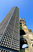 Kayser Wilhem Gedachniskirche (memory church) built in 1895 and bombed during World War II, now a war disaster symbol. New part built in 1965 by architect Egon Eiermann. Breidscheidplatz. Berlin. Germany