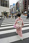 Women dressed in traditional kimono passing by in Ginza. Tokyo. Japan