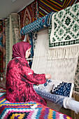 Woman weaving a carpet. Medina . Resort of Yasmine Hammamet by the mediteranean. Tunisia