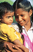Girl and baby in Kerala, India