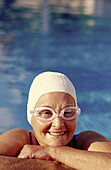 rs, 70-80 years, Adult, Adults, Bathe, Bathes, Bathing, Bathing cap, Bathing caps, Border, Caucasian, Caucasians, Color, Colour, Contemporary, Daytime, Edge, Exterior, Facial expression, Facial expres