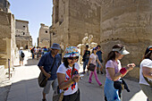 Tourists visiting. Consecrated to God Amon-Re the Luxor temple was built by Amenophis III (1391-1353) , elarged later on mostly by Ramasses II (1279-1213). The temple was linked to Karnak by a 3km alley lined with sphinxes. Luxor. Egypt