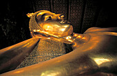 Lying Buddah s head. Wat Pho temple. Bangkok. Thailand