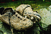  Boot, Boots, Close up, Close-up, Closeup, Color, Colour, Concept, Concepts, Daytime, Dirty, Exterior, Football, Footgear, Footwear, Horizontal, Mud, Outdoor, Outdoors, Outside, Pair, Soccer, Sport, Sports, Still life, Two, Used up, Worn out, Worn-out, B0