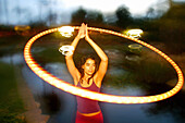 ette, Brunettes, Caucasian, Caucasians, Color, Colour, Contemporary, Dark-haired, Dusk, Exterior, Facial expression, Facial expressions, Female, Girl, Girls, Horizontal, Hula hoop, Hula hoops, Hula-ho