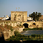 Roman bridge over Guadalquivir River and La Calahorra tower in background. Córdoba. Spain