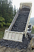 Construction of forest trail with black slag from foundry. Ormaiztegi, Guipúzcoa. Euskadi, Spain