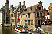 Tourist boat by Rozenhoedkaai. Brugge. Flanders, Belgium