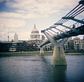 St. Paul s Cathedral and Millenium Bridge at Thames River. London. England, UK