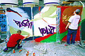Graffiti artists at work. Berlin. Germany