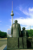 Karl Marx and Friedrich Engels statues looking at Television Tower. Rathausplatz (City Hall square). East part, formerly russian. Berlin. Germany