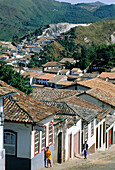City and sloppy street from top of a hill. Historic city of Ouro Preto. Minas Gerais. Brazil