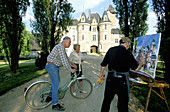Chateau des Reaux Maison d hotes owners cycling by a painter. Touraine (Chateaux country). Val-de-Loire. France